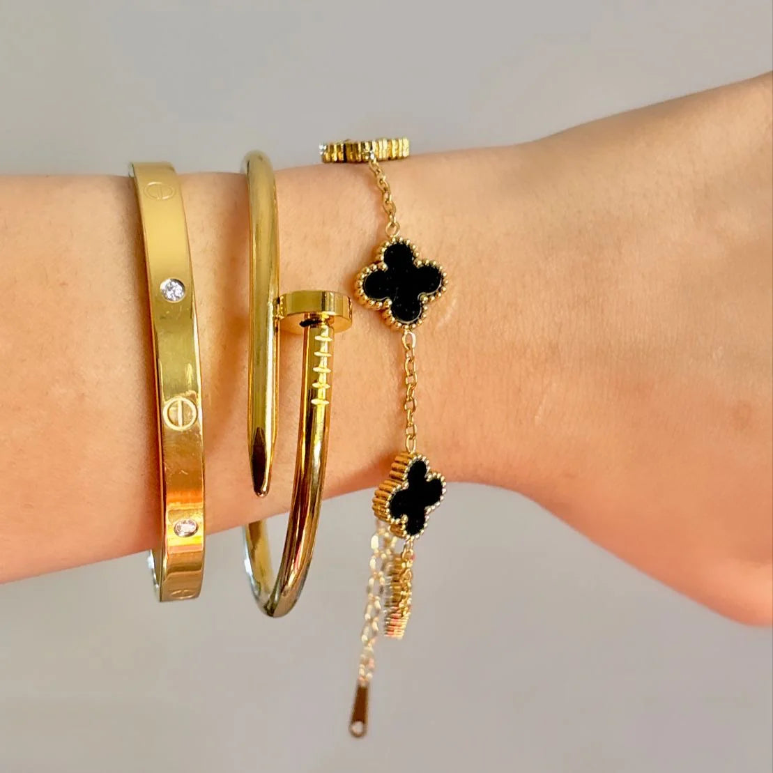 Cartier Nail, love bangle with black clover bracelet ‘Stack’