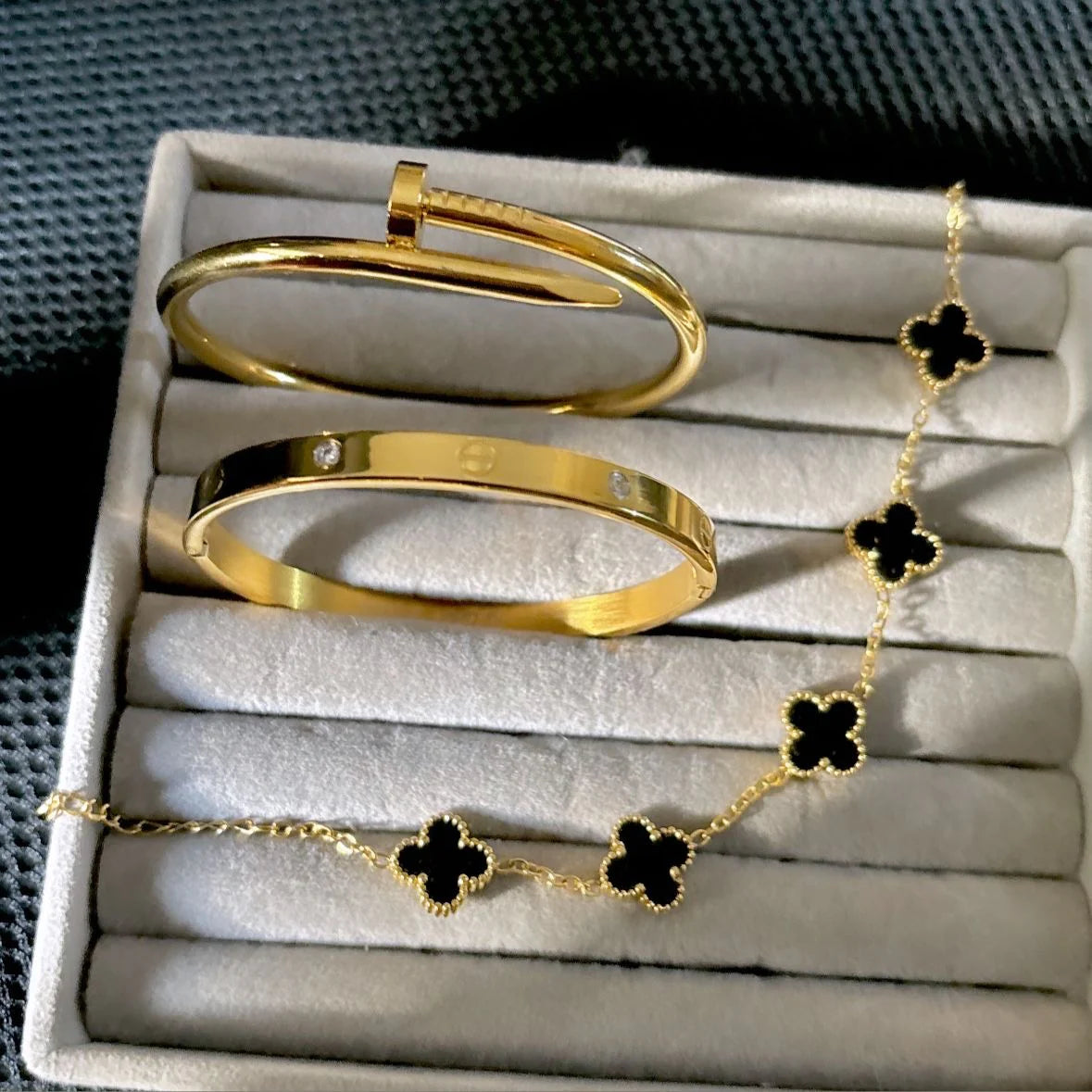 Cartier Nail, love bangle with black clover bracelet ‘Stack’